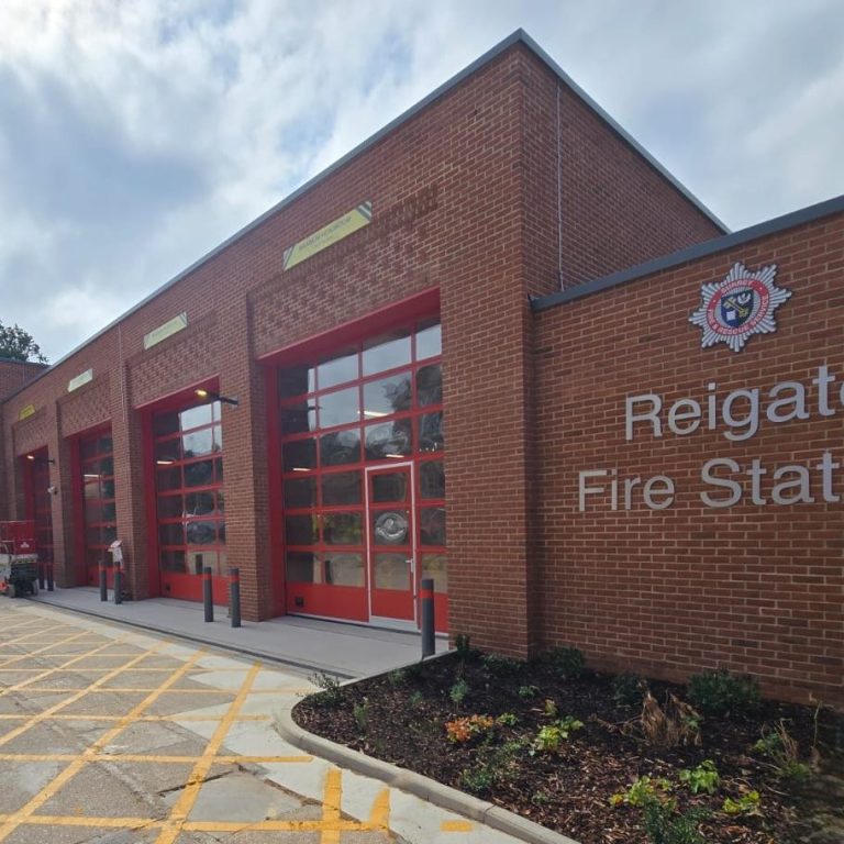 Reigate Fire Station Brick built fire station with large glass appliance bay doors